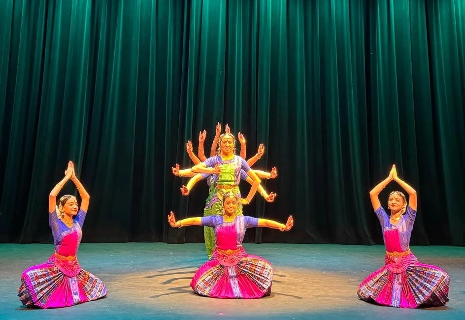 Abinaya dancers create a many-armed formation on stage